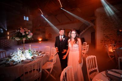 Bride and groom in Wedding venue lit up at night, in Provence