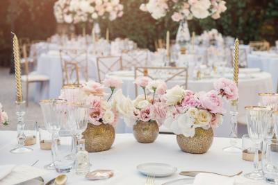 Wedding table setting with yellow roses and rose peony