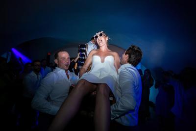 Bride lifted by her friends on the dance floor