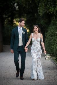 Bride and groom walking along a gravel path at a Provence wedding venue