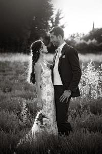 Black and white portrait of the bride and groom in a Provence field