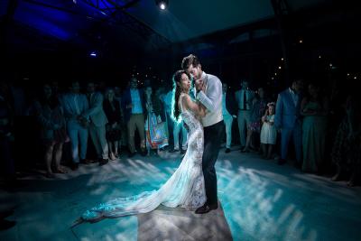 First dance under the night sky, surrounded by guests
