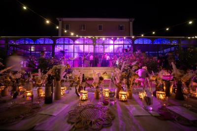 Wedding venue lit up at night with candles and lanterns, South of France